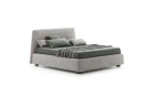 Calvin — Bed with a simple design featuring a softly rounded and smooth upholstered headboard.