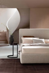 Illy — Modern minimalist bed with a wide, linear headboard.