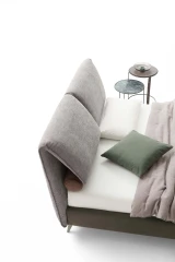Fold — Bed with a headboard made of large adjustable cushions.