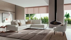 Luis — Sofa with sliding backrest and snap-reclining armrests, finished with elegant borders.