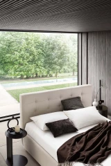 Tender — Modern squared bed with light tufting on the headboard.