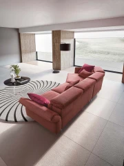 Aurora — Sofa with asymmetrical corner seating, adjustable headrests and armrests, and extendable footrest mechanism.