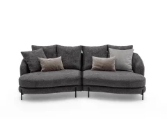 Jand — Sofa with organic shapes, high legs, round end modules, and shaped seats