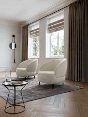 Guapa — Eccentric armchair with a quilted, rounded base and curved backrest.