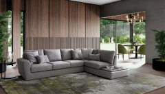 Magyster — Sofa with visible stitching and integrated side shelf.