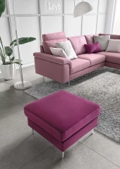 Papilio — Sofa with extendable footrest, rounded armrests, and asymmetrical corner seating.