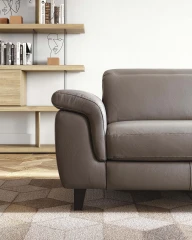 Zeno — Modern recliner sofa with adjustable headrests in a curved, enveloping design.
