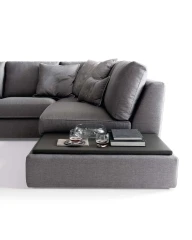 Magyster — Sofa with visible stitching and integrated side shelf.