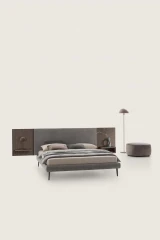 Wall — Contract bed with a simple, smooth padded headboard and side shelves.