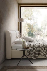 Windsor — Bed with a padded headboard composed of two delicately designed cushions.