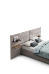 Horizon — Contract bed with a horizontally padded headboard and side shelves.
