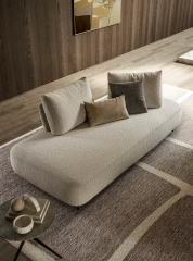 Fanny — Modular sofa with organic shapes, sliding backrests, and adjustable armrests