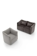 Kubik — One-piece frame armchair with a cubic shape and visible bicolor edges.