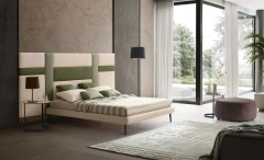 Ground — Contract bed with a headboard made of vertical padded panels.