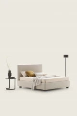 Illy — Modern minimalist bed with a wide, linear headboard.