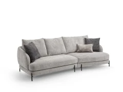 Jand — Sofa with organic shapes, high legs, round end modules, and shaped seats