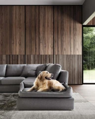 Magyster — Sofa with visible stitching and integrated side shelf.
