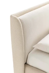 Windsor — Bed with a padded headboard composed of two delicately designed cushions.
