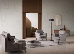 Galen — Comfortable armchair with a classic design and soft, upholstered seat and backrest complemented by plush arm cushions.
