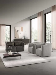 Kubik — One-piece frame armchair with a cubic shape and visible bicolor edges.