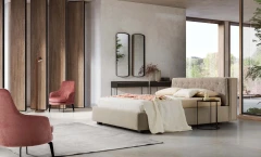 Donovan — Upholstered bed with a headboard equipped with a bookshelf and retractable LED lights.