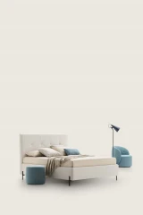 Love — Modern squared bed with light tufting on the headboard and decorative piping.