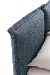 Catlin — Bed with a headboard composed of padded cushions with wide borders.