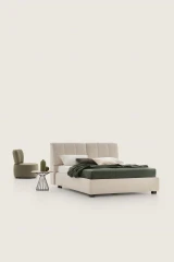 Inside — Bed with a tufted headboard and a built-in storage compartment.