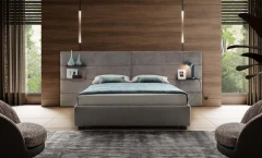 Horizon — Contract bed with a horizontally padded headboard and side shelves.