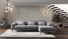 Harvey — Rounded sofa with extendable seats and adjustable headrests.