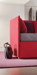 Solanum — Single corner daybed with a wave-shaped backrest.