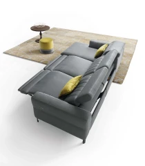 Egon — Recliner sofa with adjustable headrests, and vertically stitched backrest.