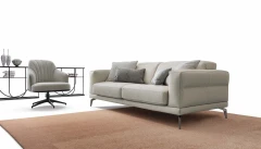 Lambert — Modern sofa with sliding seats, adjustable headrests, and raised borders.