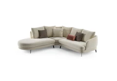 Jand — Sofa with organic shapes, high legs, round end modules, and shaped seats
