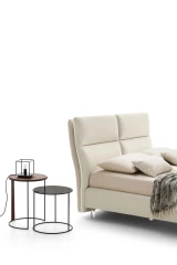 King — Modern bed with a wide headboard composed of two large vertical cushions split in the middle.