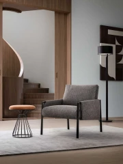 Andy — Armchair with painted metal frame and padded seat, backrest, and armrests. Contemporary industrial design.