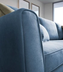 Lola — Space-saving sofa with decorative borders and highlighted stitching.