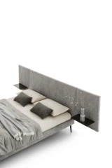 Wall — Contract bed with a simple, smooth padded headboard and side shelves.