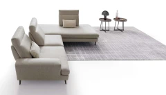 Emmet — Sofa with sliding backrests.