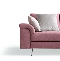 Papilio — Sofa with extendable footrest, rounded armrests, and asymmetrical corner seating.