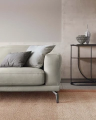 Lambert — Modern sofa with sliding seats, adjustable headrests, and raised borders.