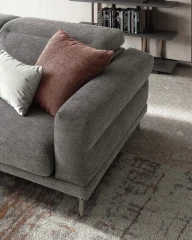 Lambert — Modern sofa with sliding seats, adjustable headrests, and raised borders.