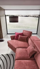 Aurora — Sofa with asymmetrical corner seating, adjustable headrests and armrests, and extendable footrest mechanism.