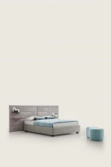 Horizon — Contract bed with a horizontally padded headboard and side shelves.