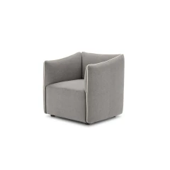 Kubik — One-piece frame armchair with a cubic shape and visible bicolor edges.