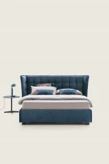 Aspen — Wingback bed with a quilted headboard.