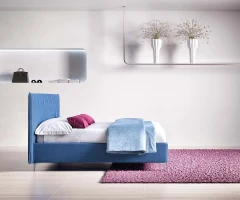 Plumeria — Space-saving bed with a vertically stitched padded headboard.