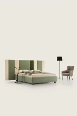 Ground — Contract bed with a headboard made of vertical padded panels.