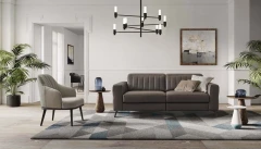 Egon — Recliner sofa with adjustable headrests, and vertically stitched backrest.