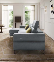 Egon — Recliner sofa with adjustable headrests, and vertically stitched backrest.